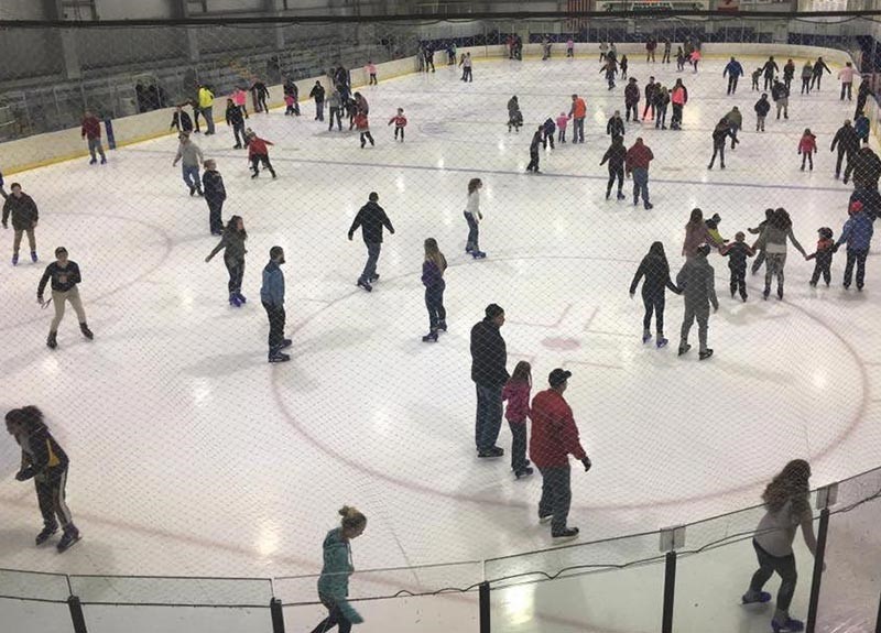 indoor ice rink with skaters